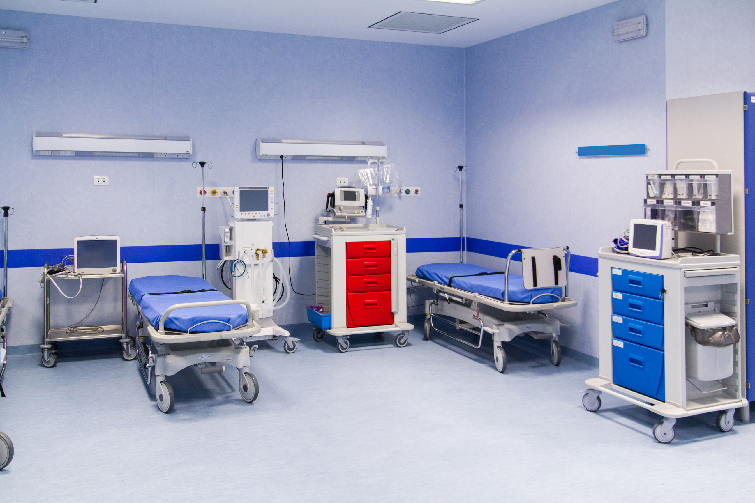 blue covered hospital beds