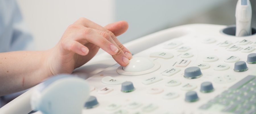 young-woman-doctor-s-hands-close-up-preparing-for-an-ultrasound-device-scan-.jpg